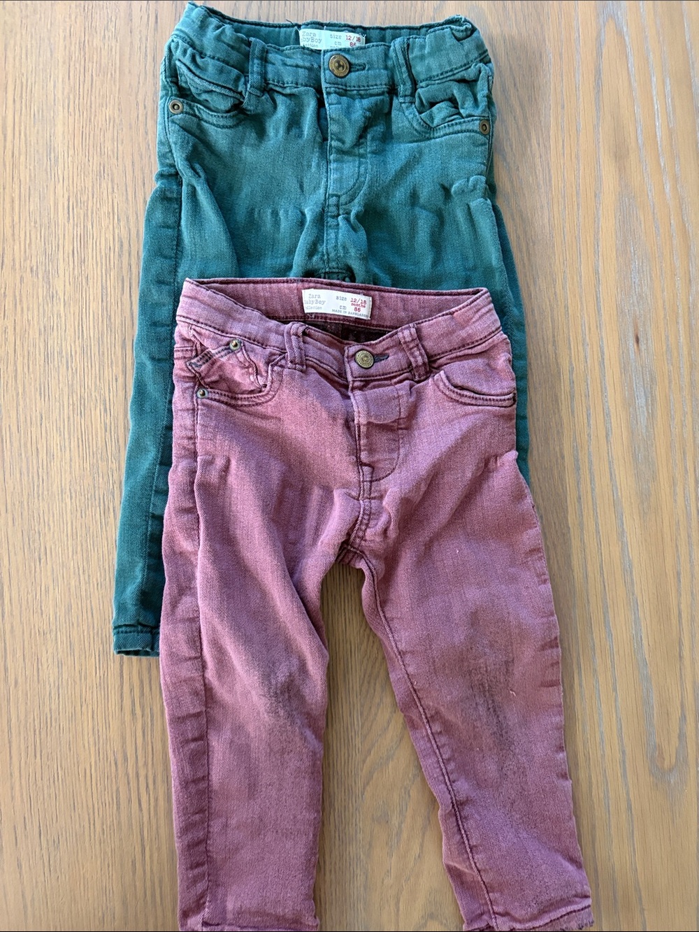 Zara- babies 12-18 month jeans. Green and maroon. 2 pairs.